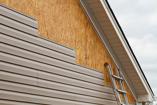 Professional Storm Damage Siding Repair technician working in Snow Shoe, PA